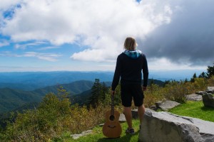 https://www.guitarlessons-atlanta.com/wp-content/uploads/2012/11/jimmy-acoustic-in-the-mountains-300x200.jpg