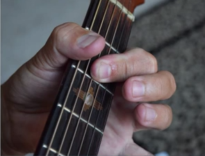 https://www.guitarlessons-atlanta.com/wp-content/uploads/2015/07/jimmy-cypher-showing-guitar-chord.png